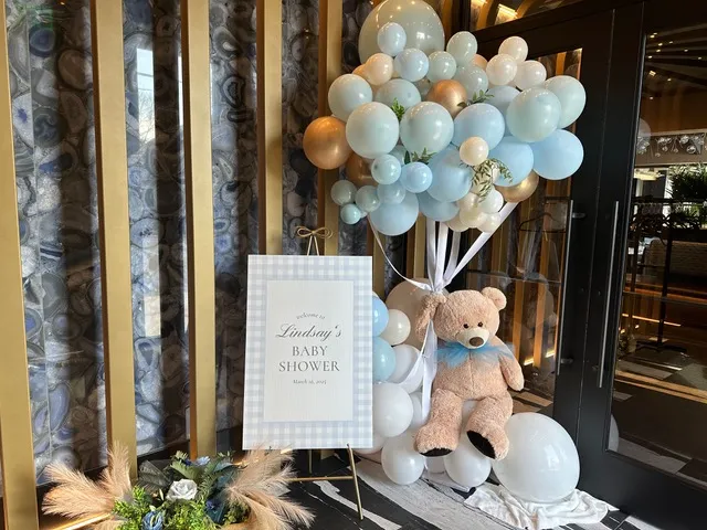 A balloon arch welcoming guests to a baby shower