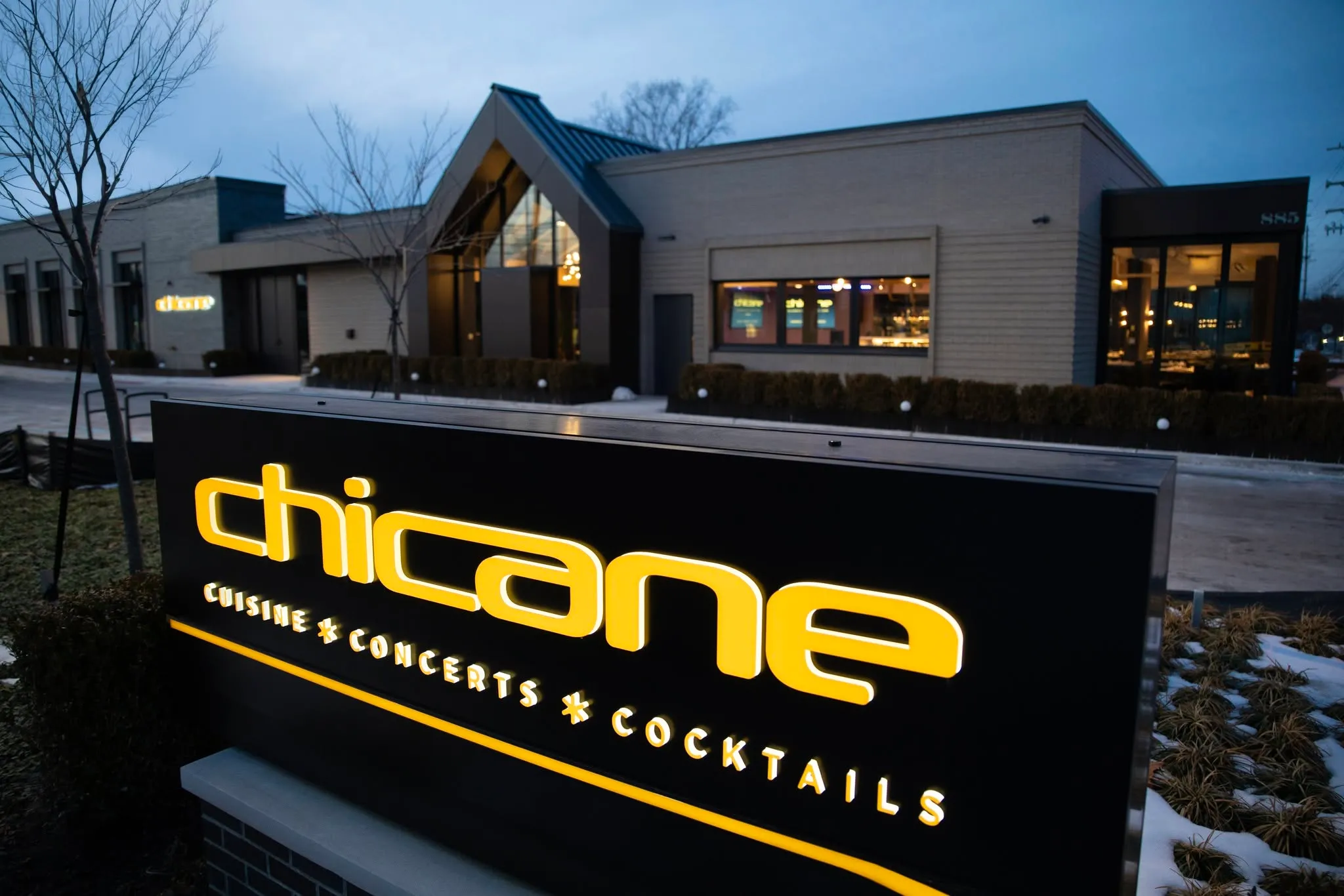 The Chicane sign lit at dusk