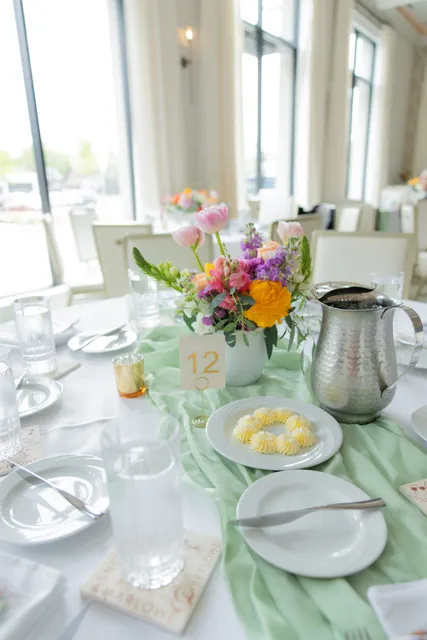 A luncheon table with spring florals and a mint runner