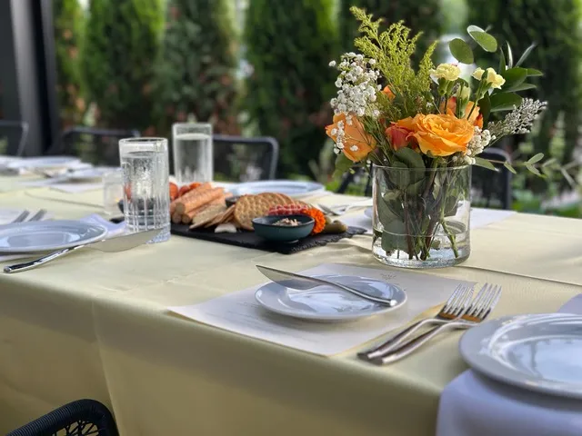 A patio place setting with a charcuterie board