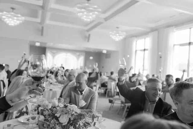 Guests raising their glasses for a toast