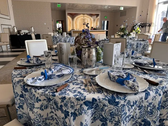 Round tables dressed in blue toile for a shower