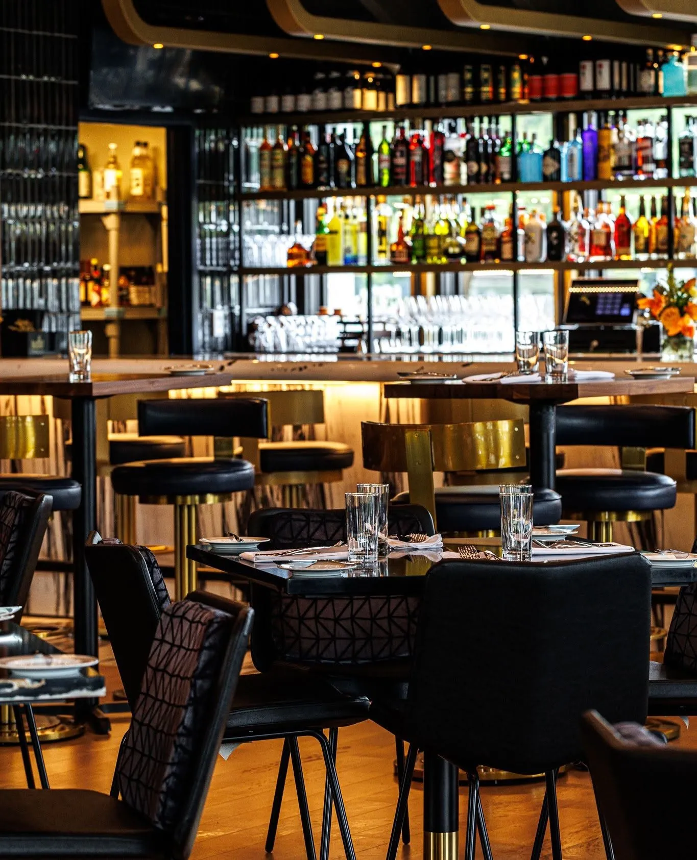 Tables set beside the back bar